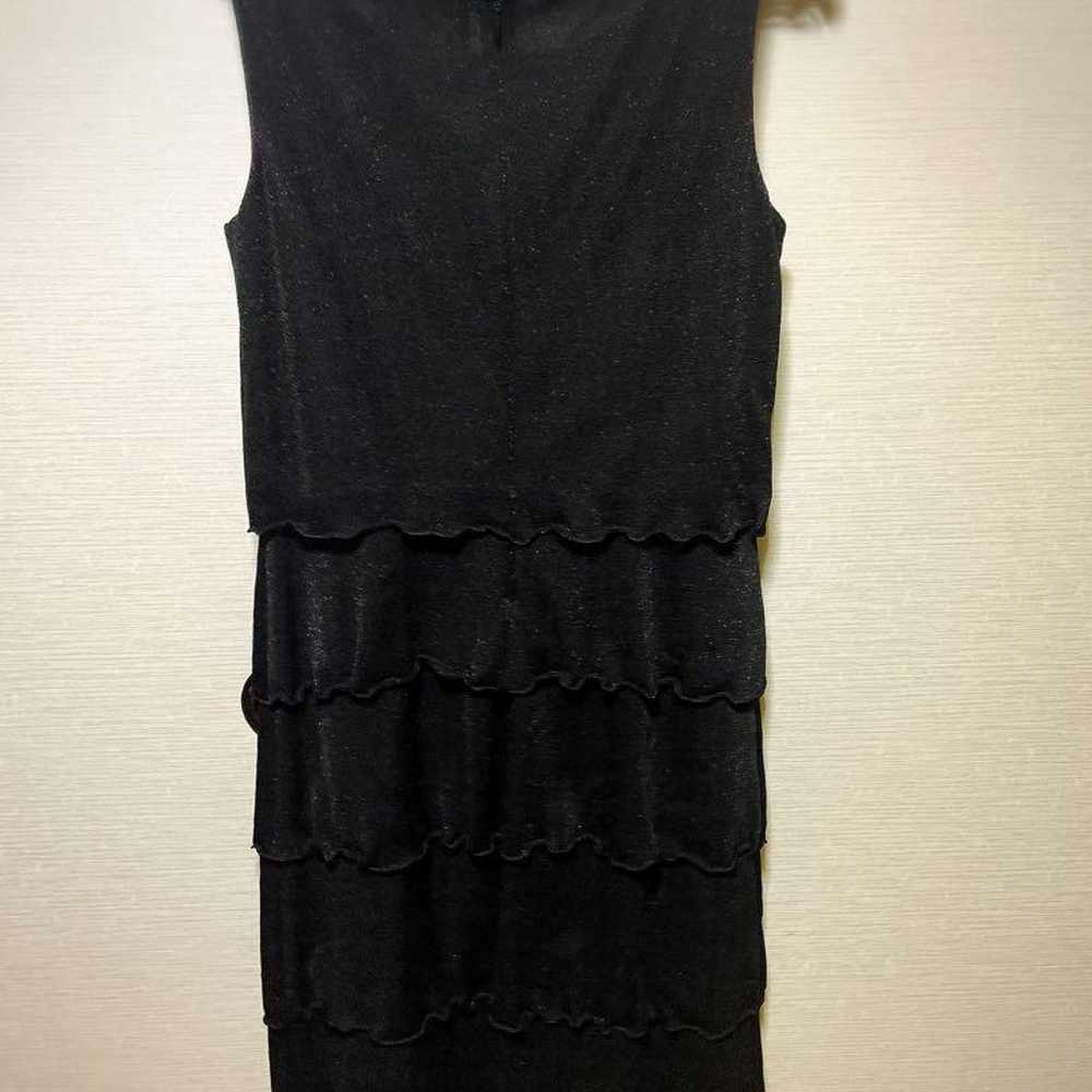 Black sleeveless dress with frill design. - image 2