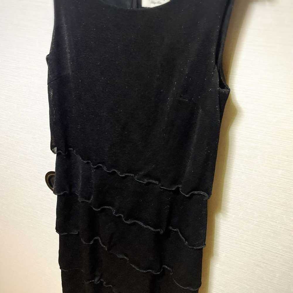 Black sleeveless dress with frill design. - image 3