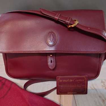 Cartier Must Line leather crossbody shoulder bag.