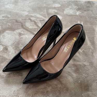 Black enamel high heel pumps