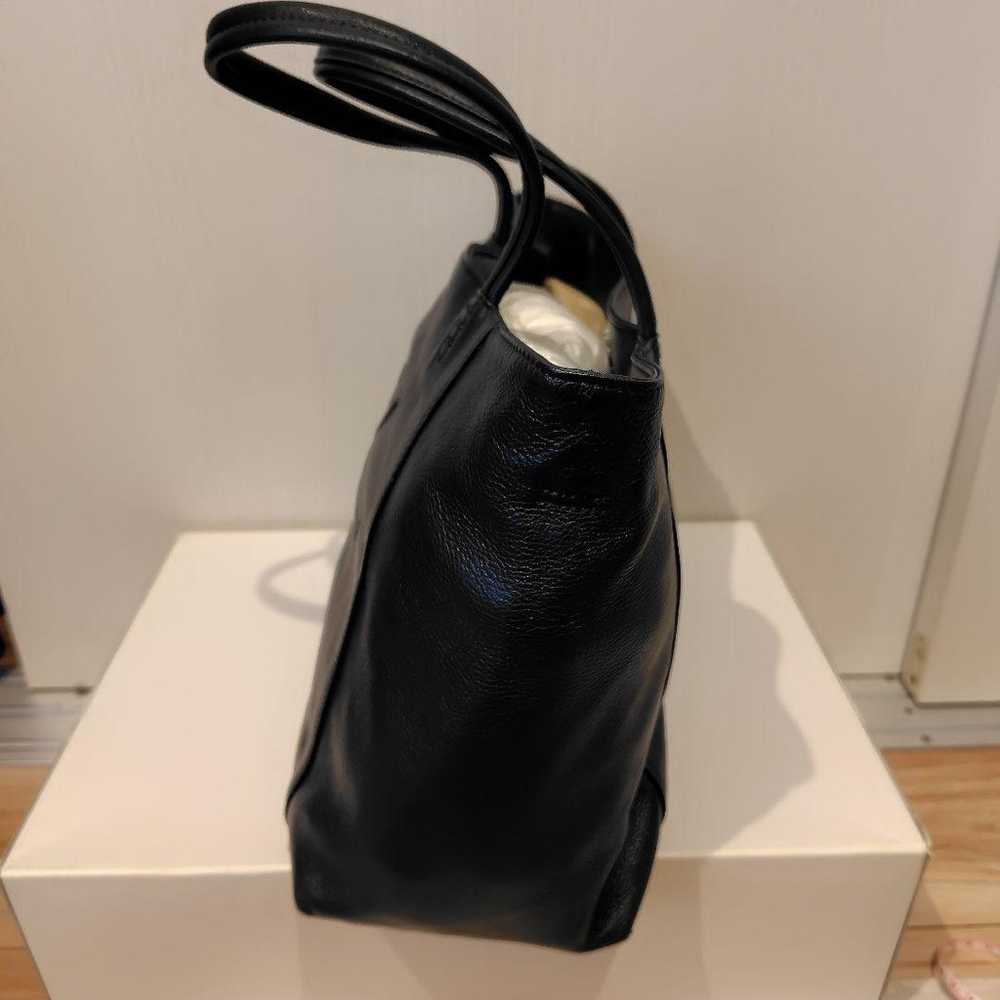 This is a navy leather tote bag from Kitamura. - image 2