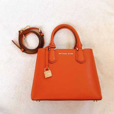 Michael Kors bag in orange color.