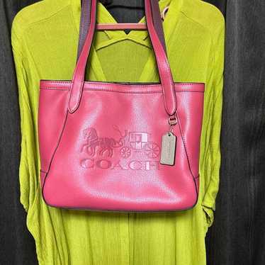 COACH pink tote bag.