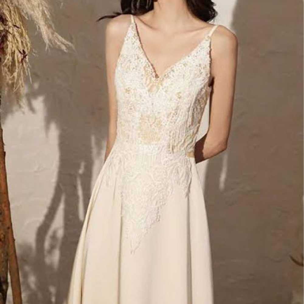 V-neck sleeveless beige wedding dress. - image 2