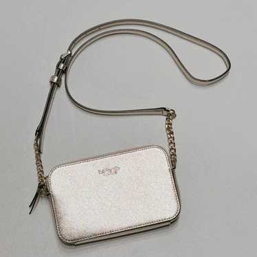 Kate Spade gold metallic shoulder crossbody chain.