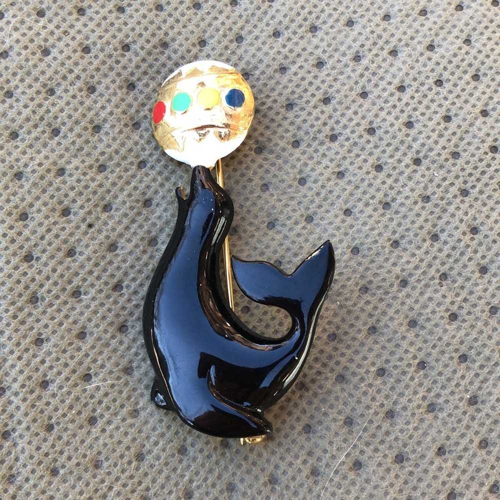 Vintage black enamel seal pin balancing beach ball - image 3