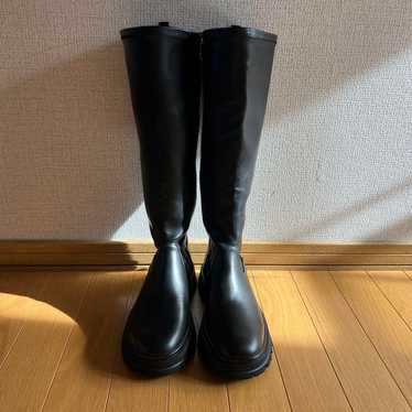 Black synthetic leather long boots unused.