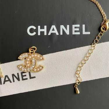 Vintage button charm with a CHANEL necklace attac… - image 1