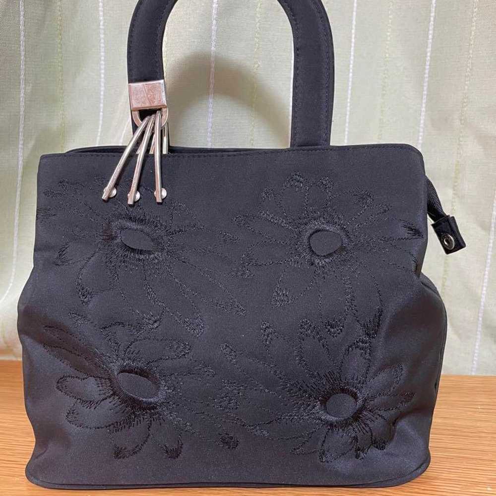 Black embroidered handbag. - image 1