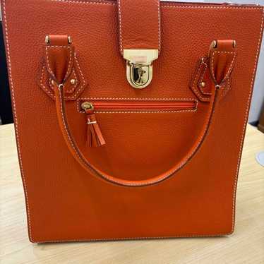 Orange leather tote bag with gold hardware. - image 1