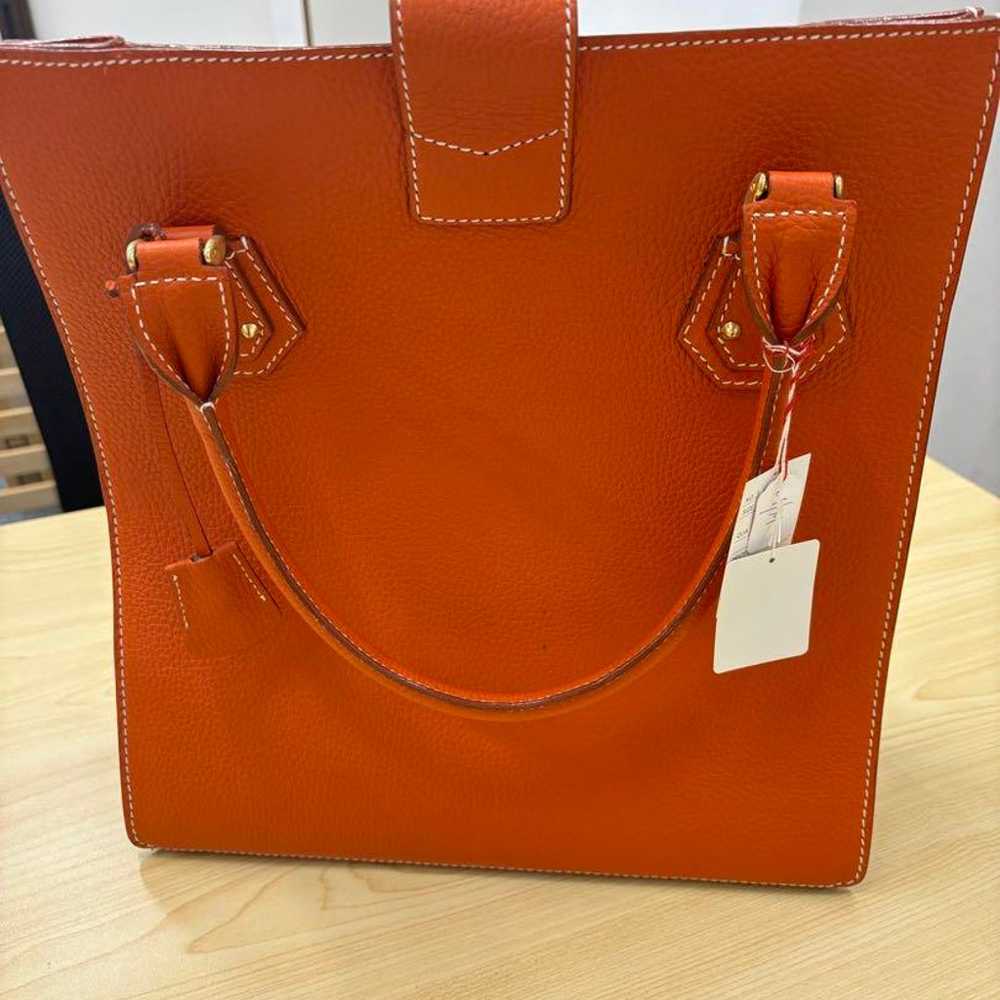 Orange leather tote bag with gold hardware. - image 2