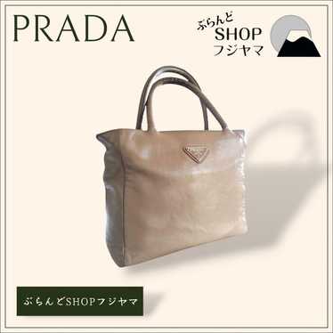 PRADA triangular logo plate beige handbag.