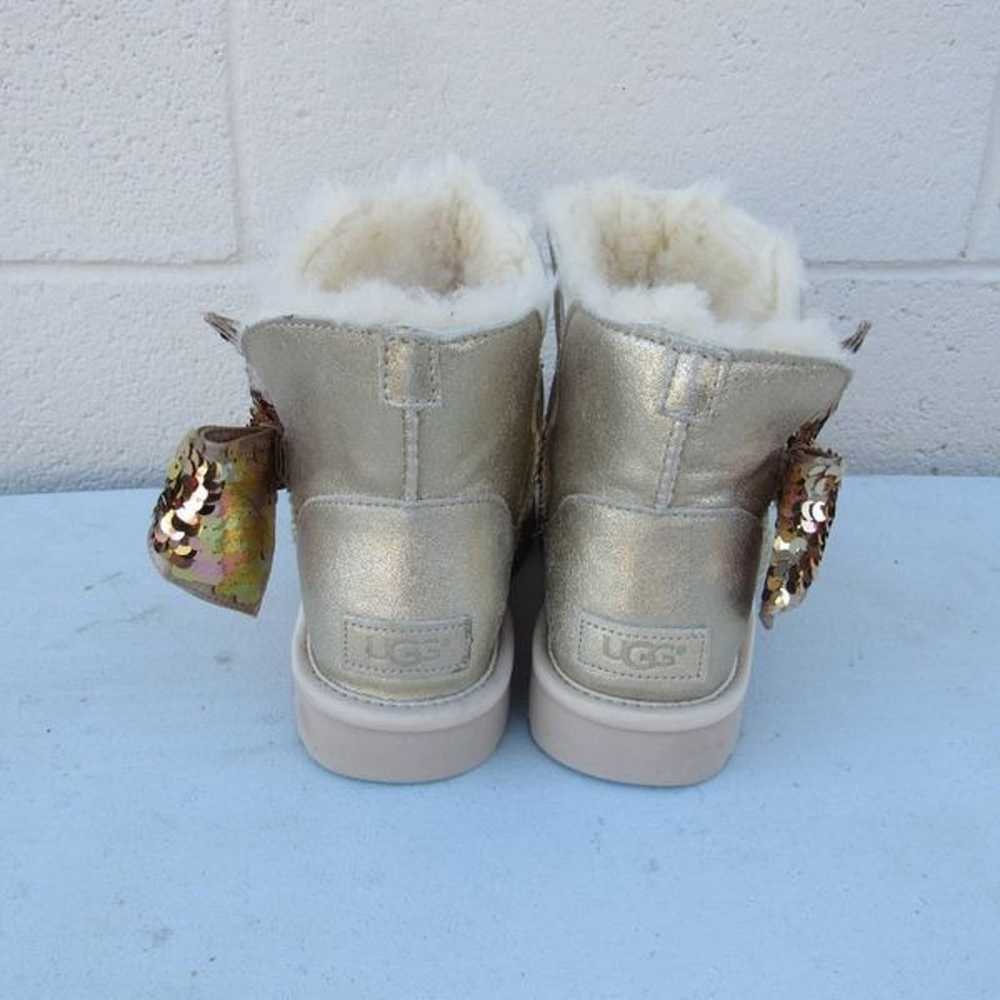 UGG WOMEN'S MINI SEQUIN BOW BOOTS GOLD - image 5