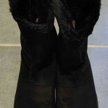 Black shearling boots with fur.