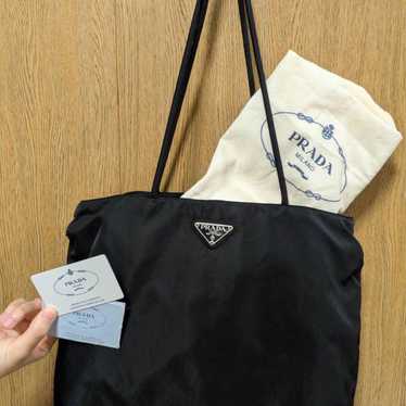 Prada tote bag with cover.