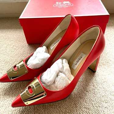 Coach red pumps with chunky heels.