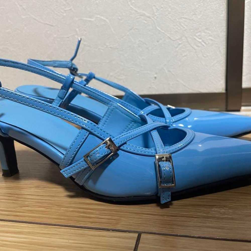 Blue pointed-toe pumps with cross straps. - image 2