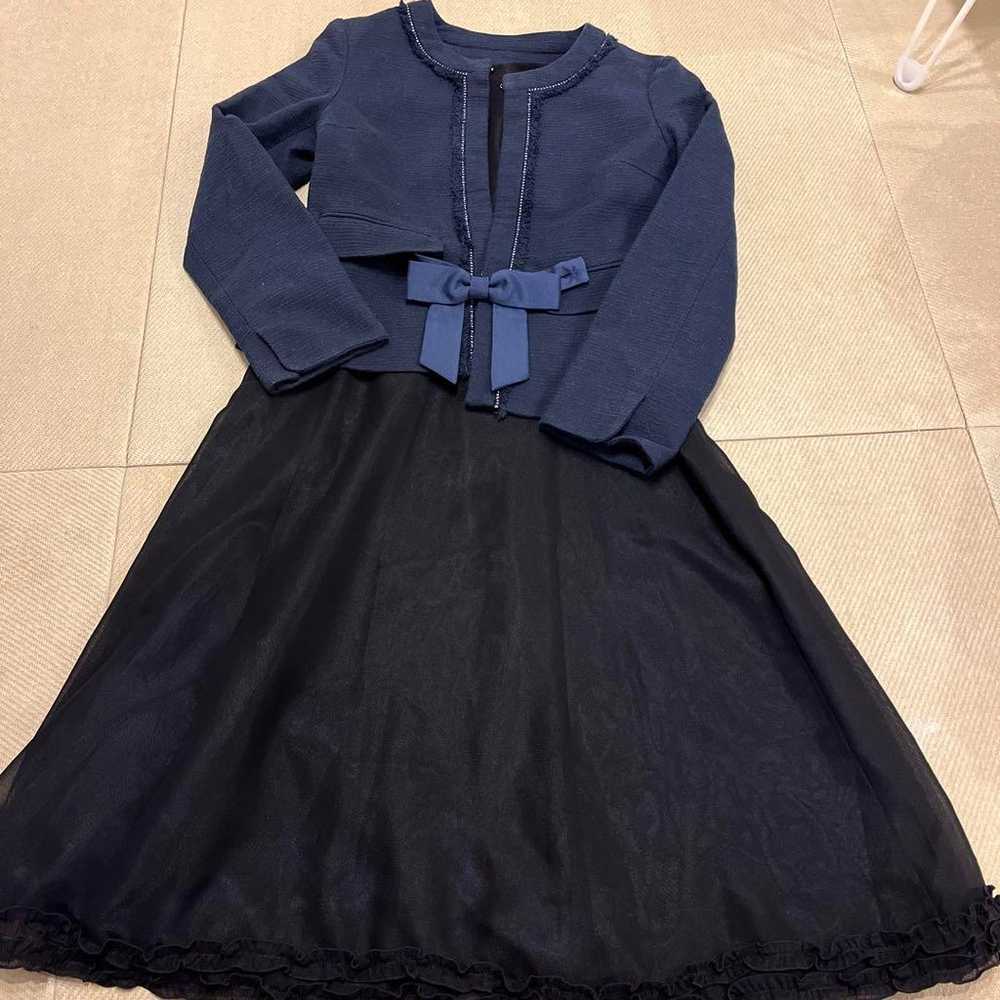 A black dress and a navy suit (with a ribbon). - image 1