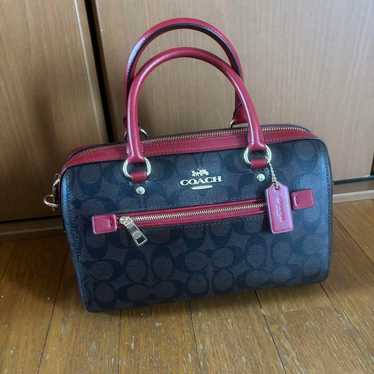 Coach signature bag.