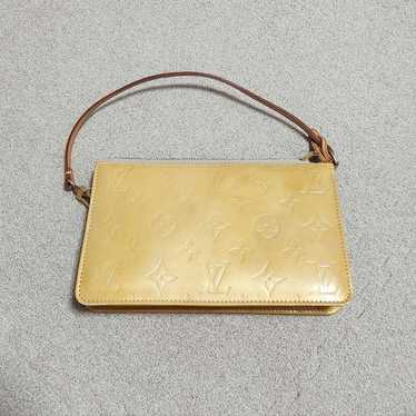 Louis Vuitton clutch bag.