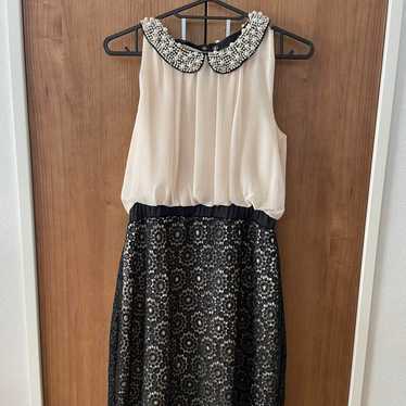 Pearl-embellished sleeveless dress.