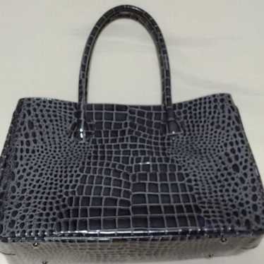 Montowa
Embossed Crocodile
Black
Excellent conditi