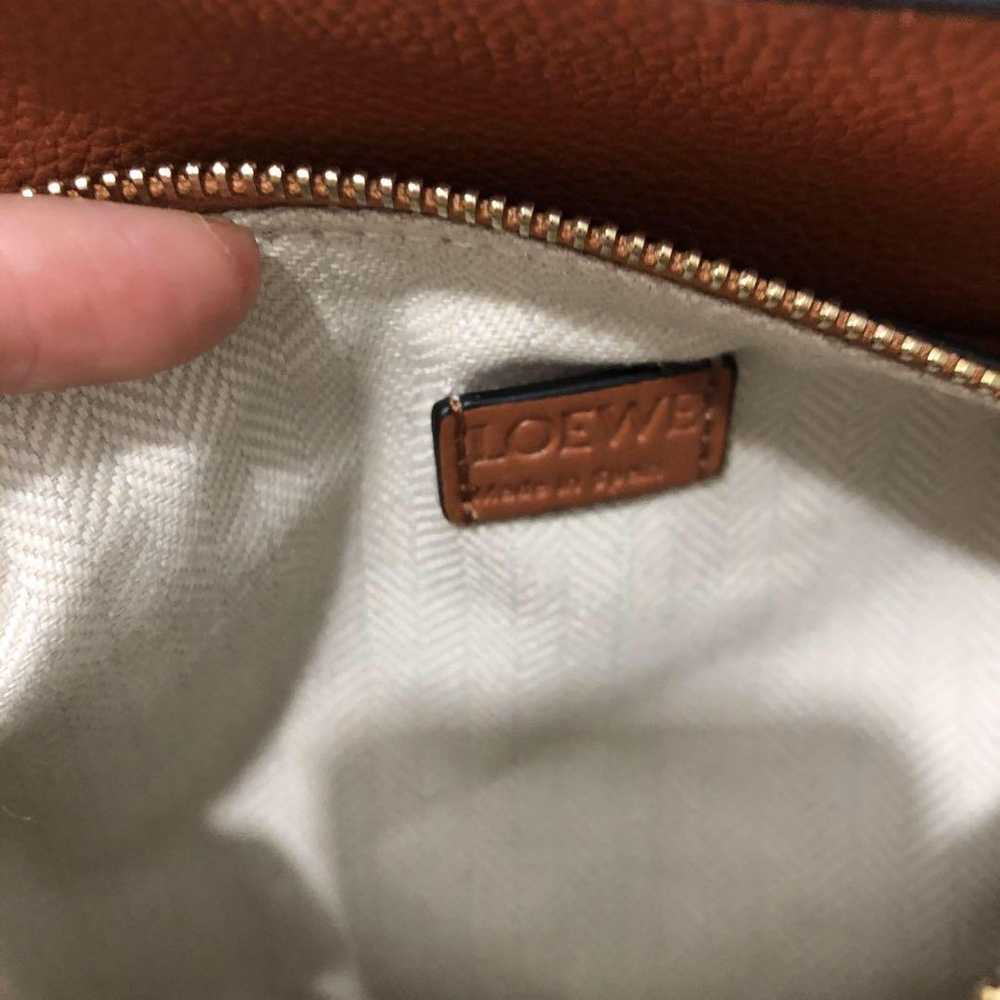 I carry a shoulder bag. - image 10