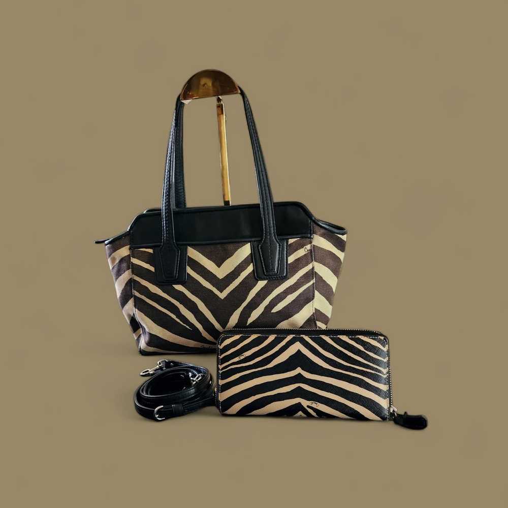 Coach Taylor zebra print canvas and black leather… - image 3