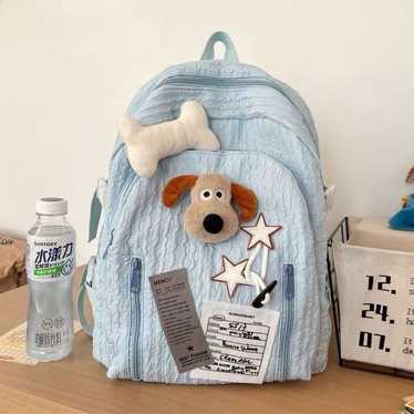 Light blue dog motif medium-sized backpack