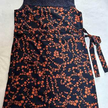 A black and orange floral sleeveless dress. - image 1