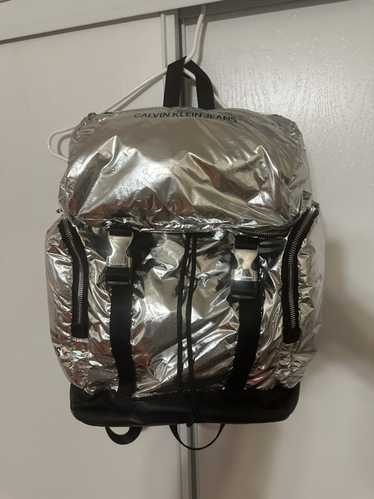 Calvin Klein Silver metallic backpack with detacha