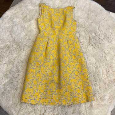 Yellow floral sleeveless knee-length dress.