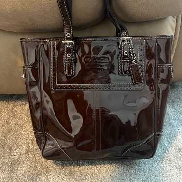 Shiny brown vintage Coach purse with matching wall