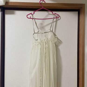 Light cream colored long camisole dress.