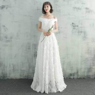 Off-shoulder wedding dress in white for a second … - image 1