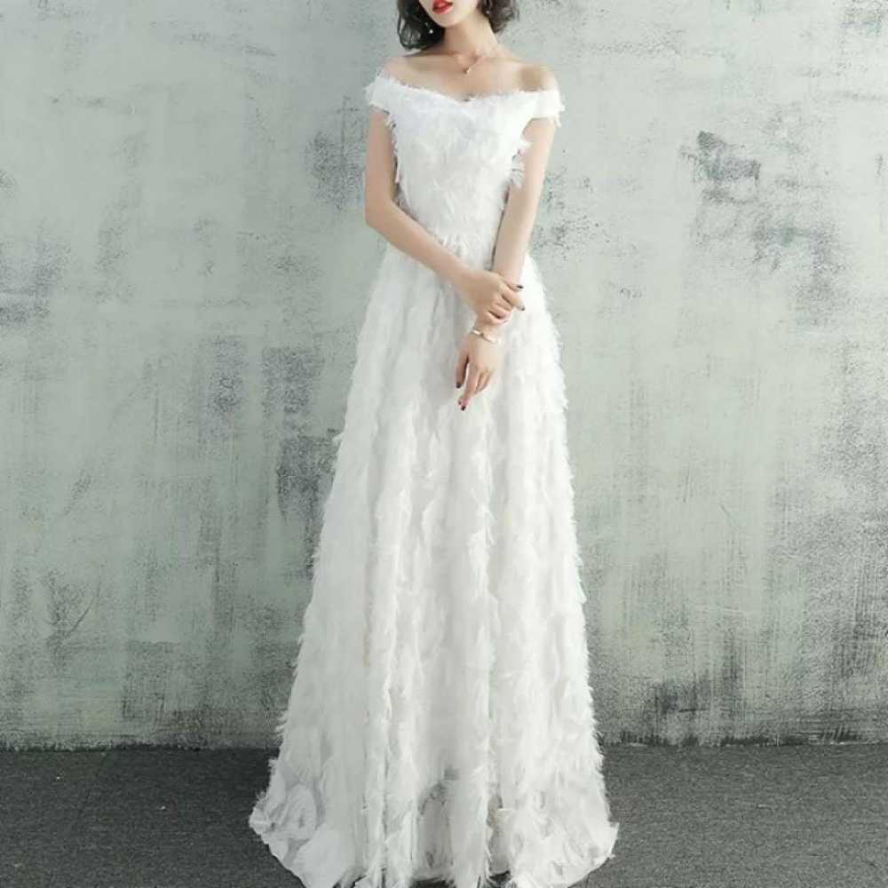 Off-shoulder wedding dress in white for a second … - image 2