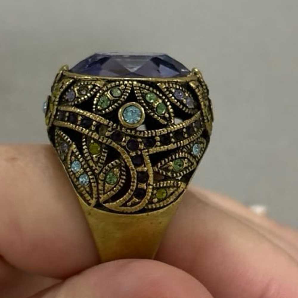 Gold colored large cocktail ring with purple stone - image 2