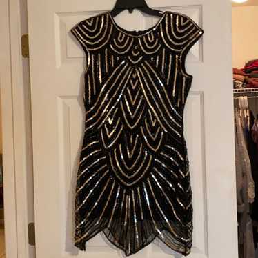 Black and gold sequin dress