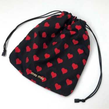 Miu Miu heart-shaped pouch.