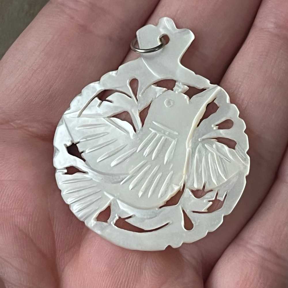 Mother of Pearl carved bird pendant - image 1