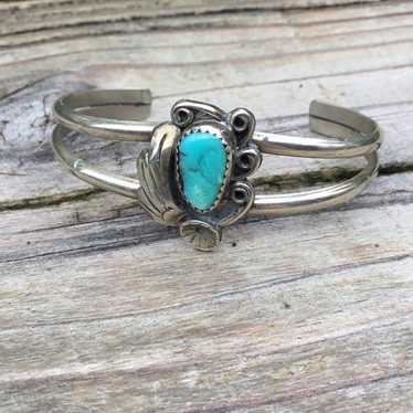 Unmarked sterling silver and turquoise bangle brac