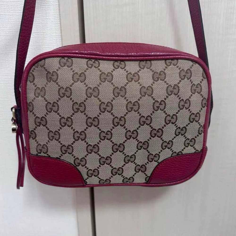 GUCCI shoulder bag with GG pattern in red. - image 1