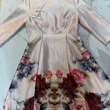 Light pink Chinese dress with a floral pattern.