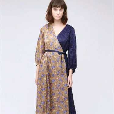 A gold and navy floral lace dress.