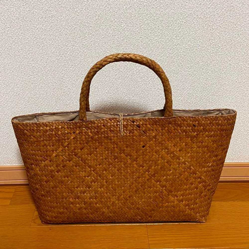 A basket bag embellished with flower embroidery. - image 2