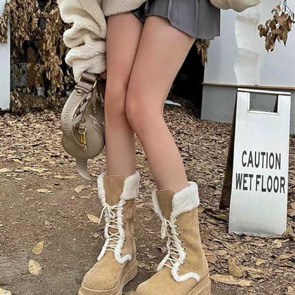 Beige suede boots with thick soles, made of shear… - image 1