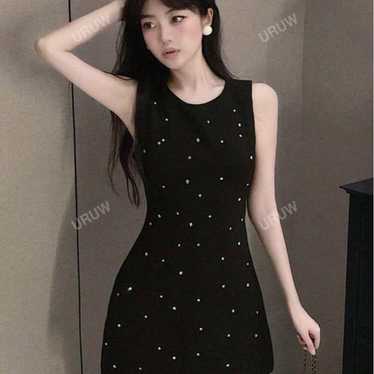 Black sleeveless mini dress with embellishments - image 1