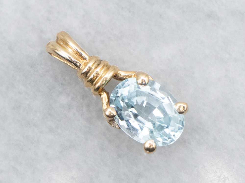 Blue Topaz Solitaire Pendant in Yellow Gold - image 1