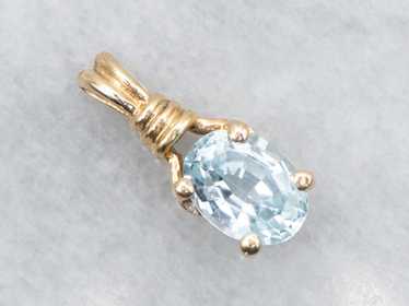 Blue Topaz Solitaire Pendant in Yellow Gold - image 1