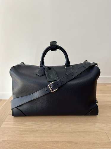 Louis Vuitton LV Taiga leather travel bag